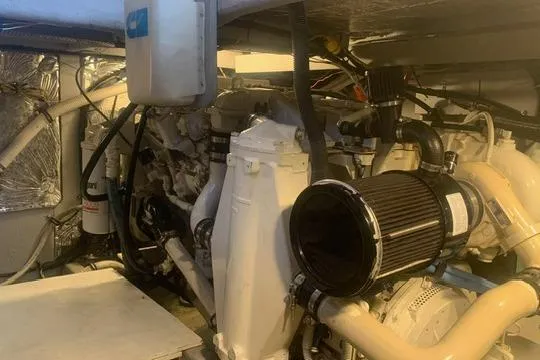 Slide: The Image of Engine room of a 2006 Meridian 411 Sedan yacht, showcasing mechanical components and systems. - 79