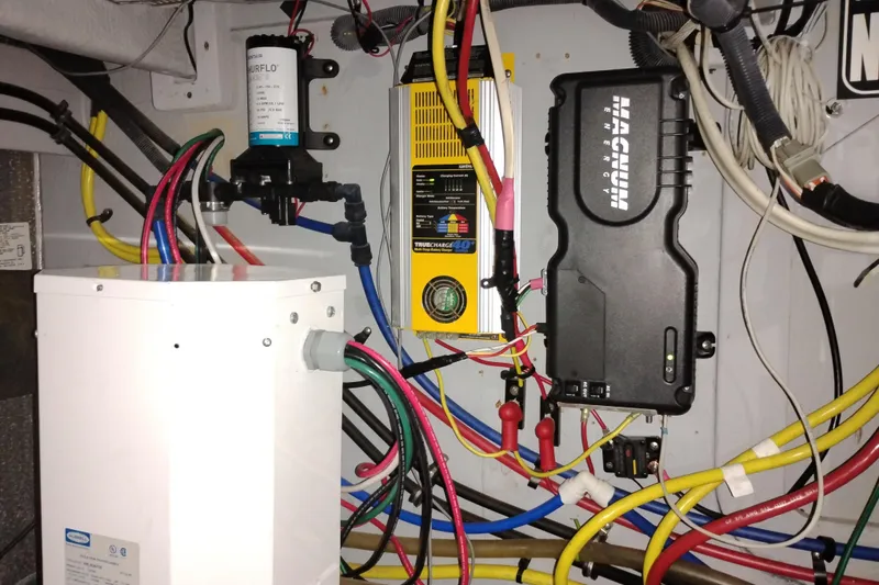 Slide: The Image of Electrical system setup in a 2006 Meridian 411 Sedan with various cables and components. - 81