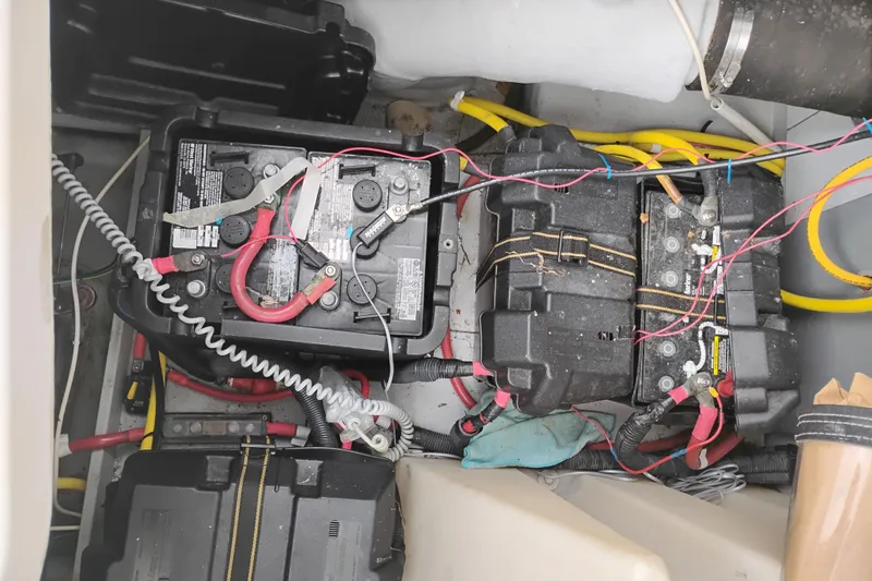 Slide: The Image of Battery compartment of a 2006 Meridian 411 Sedan with cables and connections. - 83