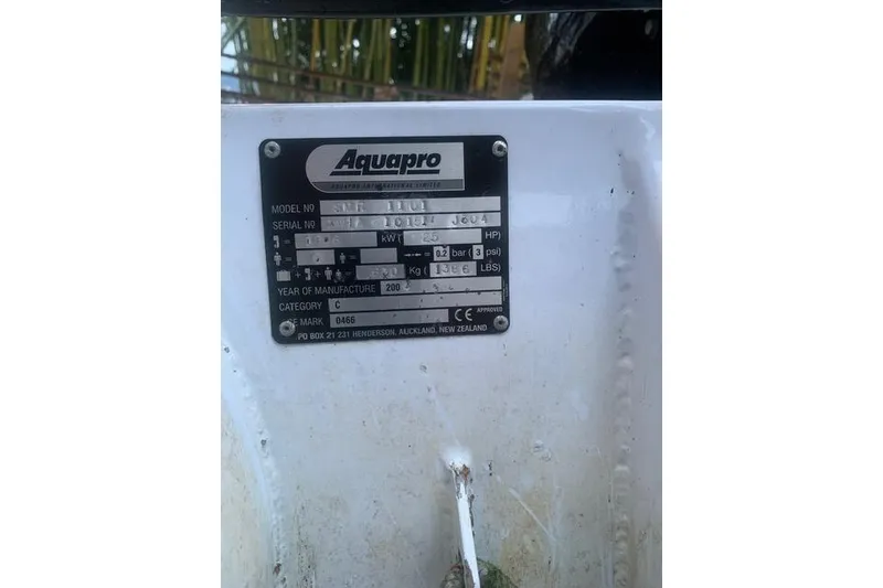 Slide: The Image of Aquapro model plate on a 2006 Meridian 411 Sedan boat, displaying specifications. - 84