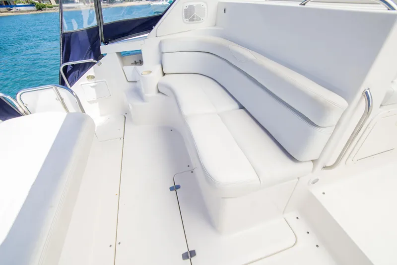 Slide: The Image of Luxurious white seating on 2003 Regal Commodore 4260 yacht, with ocean view. - 14