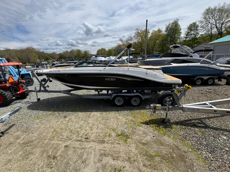 Slide: The Image of Interior of a 2021 Sea Ray 230SPX boat with steering wheel and seat. - 15