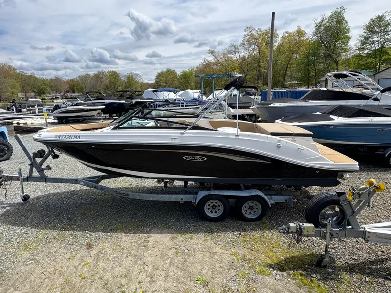 Slide: The Image of Interior of a 2021 Sea Ray 230SPX boat with beige seating. - 17