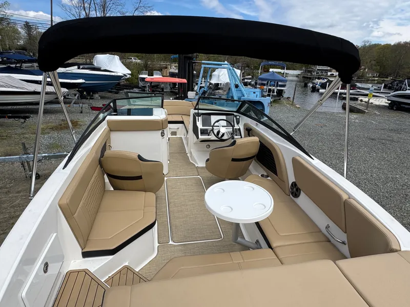 Slide: The Image of Interior of a 2021 Sea Ray 230SPX boat with steering console. - 19