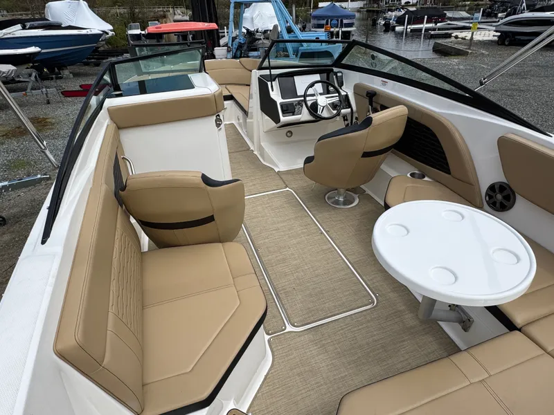 Slide: The Image of Interior of 2021 Sea Ray 230SPX featuring toilet and beige upholstery. - 21