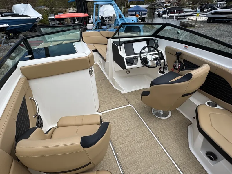 Slide: The Image of Interior of 2021 Sea Ray 230SPX featuring portable toilet. - 22