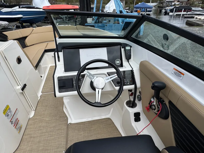 Slide: The Image of Interior of a 2021 Sea Ray 230SPX with beige upholstery. - 24