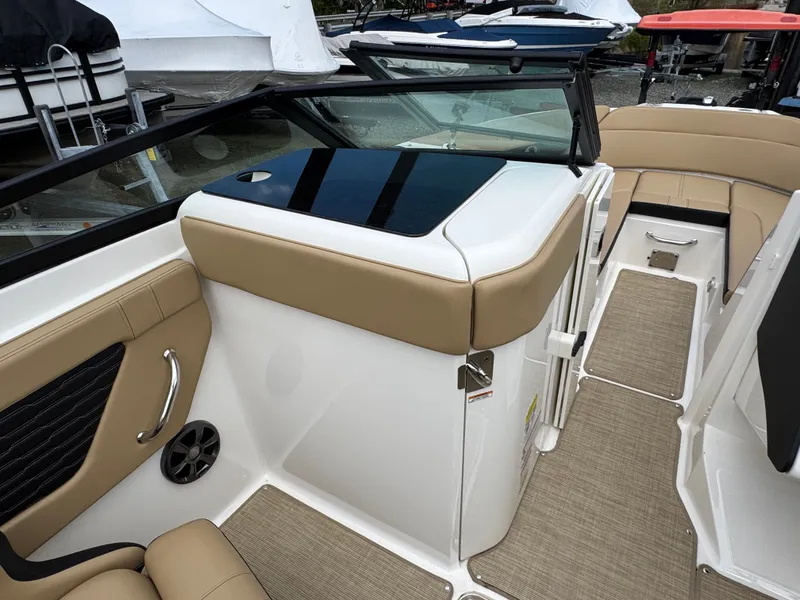 Slide: The Image of 2021 Sea Ray 230SPX boat with open deck and seating area. - 27