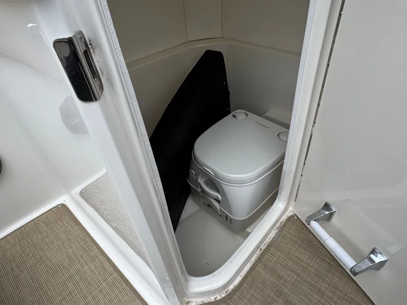 Slide: The Image of Engine compartment of a 2021 Sea Ray 230SPX boat with Mercury 250 engine. - 29
