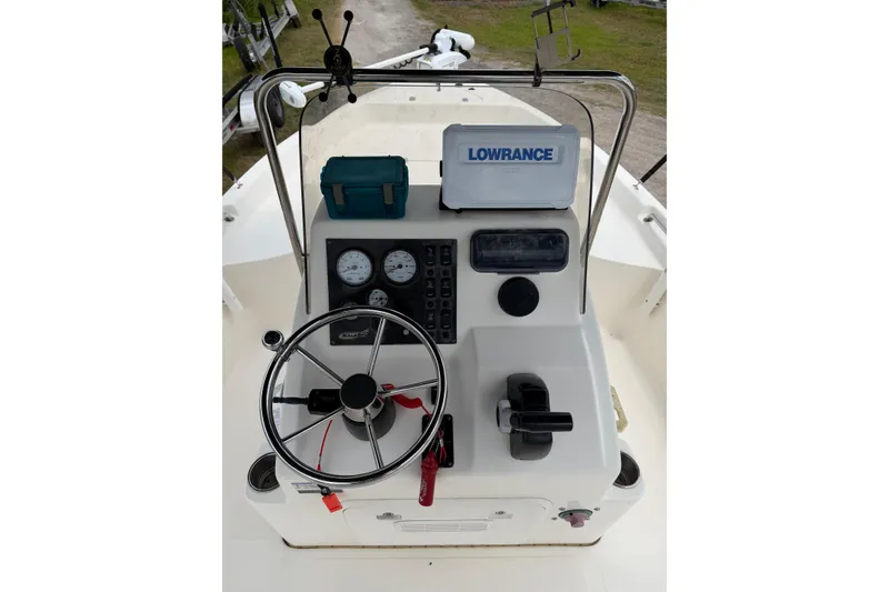Slide: The Image of 2016 Bulls Bay 2000 boat console with steering wheel and Lowrance equipment. - 4