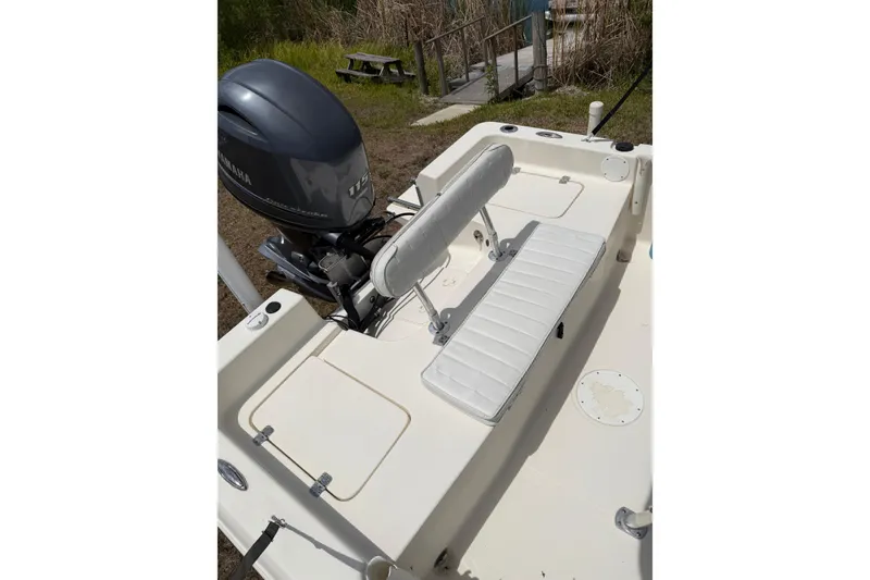 Slide: The Image of 2016 Bulls Bay 2000 boat with Yamaha 115 engine, featuring white seating and deck. - 6