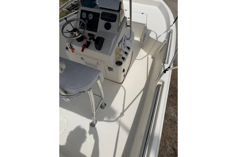 Slide: The Image of 2016 Bulls Bay 2000 boat interior with steering console and seating. - 9