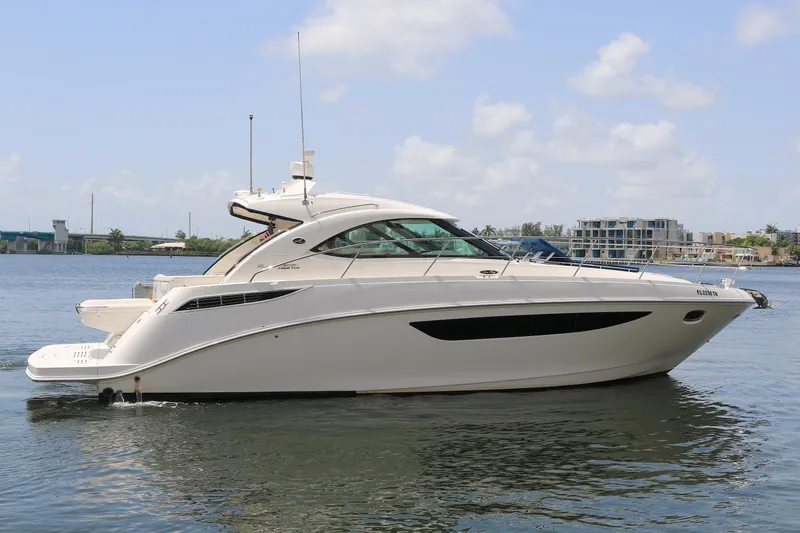 The Image of 2013 Searay 41 yacht on calm water, showcasing sleek design and modern features. - 0
