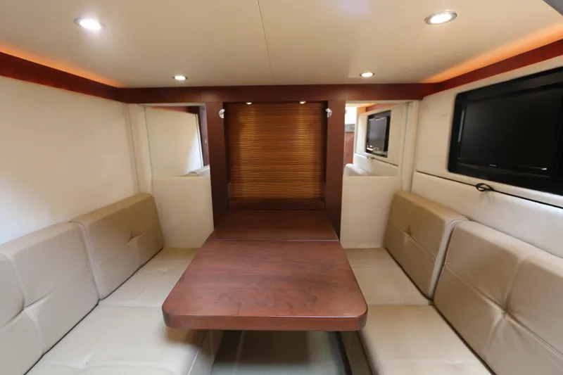 Slide: The Image of Luxurious interior of 2013 Searay 41 yacht with plush seating and wooden table. - 11