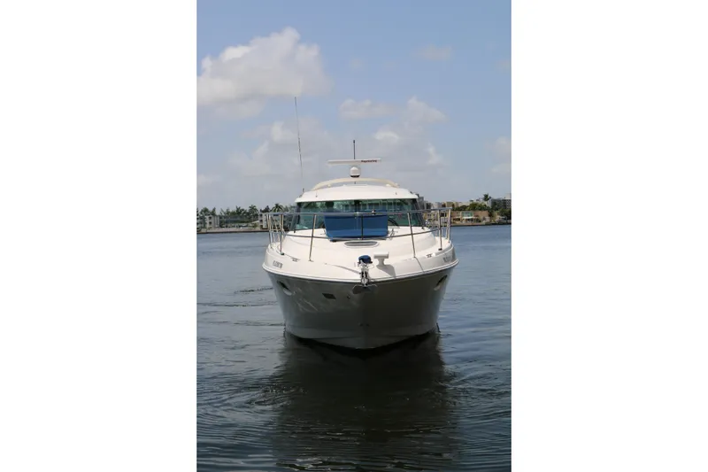 Slide: The Image of 2013 Searay 41 yacht on calm water under a partly cloudy sky. - 19