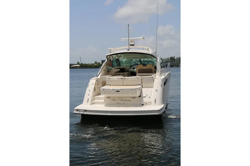 Slide: The Image of 2013 Searay 41 yacht on calm water, rear view with clear sky. - 20
