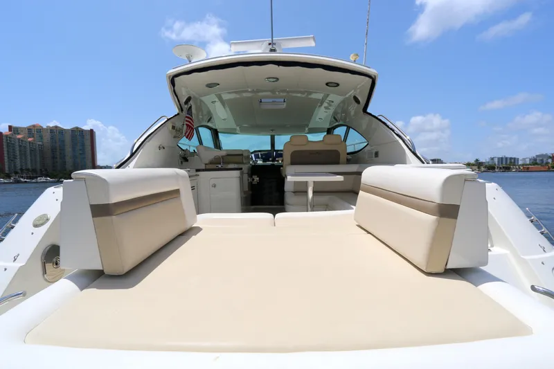 Slide: The Image of 2013 Searay 41 yacht interior with seating, table, and water view. - 3