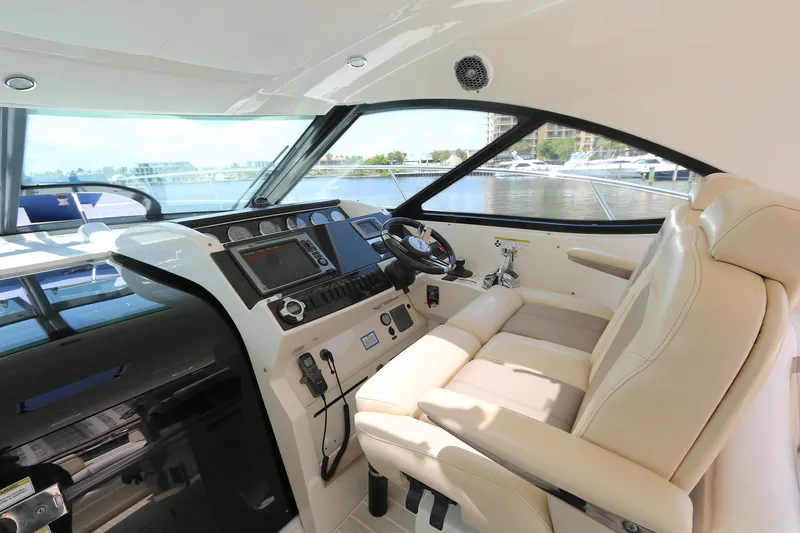 Slide: The Image of Interior view of 2013 Searay 41 yacht cockpit with luxurious seating and control panel. - 8