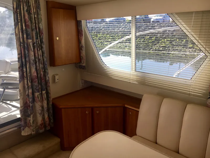 Slide: The Image of Interior of 1999 Silverton 351 Sedan yacht with window view. - 18