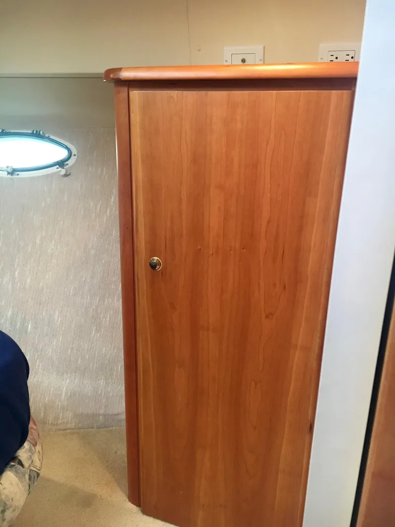 Slide: The Image of Interior of 1999 Silverton 351 Sedan with wooden door. - 26