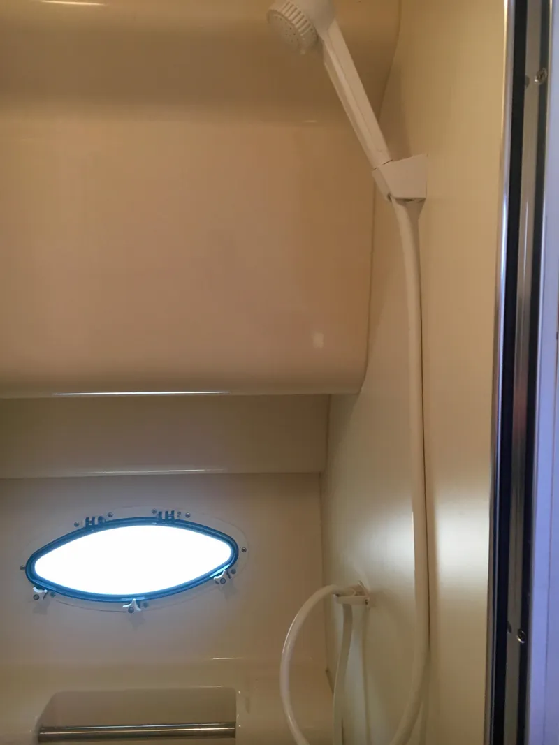 Slide: The Image of Shower in 1999 Silverton 351 Sedan with porthole. - 32