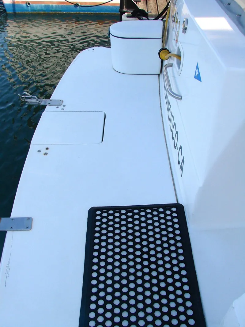 Slide: The Image of 1999 Silverton 351 Sedan boat deck with non-slip mat. - 33