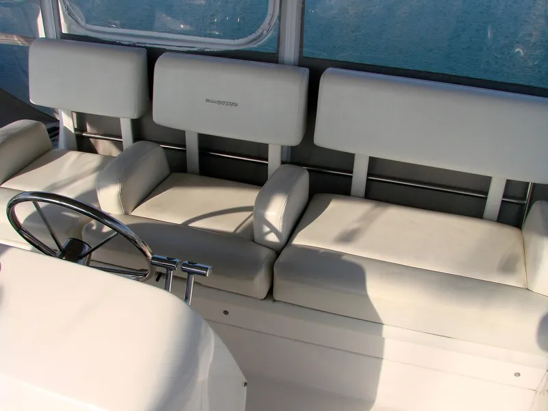 Slide: The Image of Interior of a 1999 Silverton 351 Sedan with white leather seats. - 34