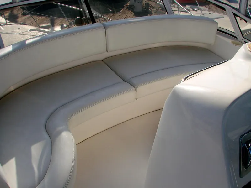 Slide: The Image of Interior of 1999 Silverton 351 Sedan with white seating area. - 35