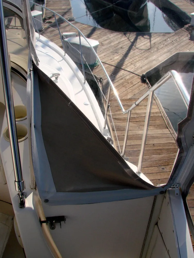 Slide: The Image of 1999 Silverton 351 Sedan yacht at dock with cover. - 36