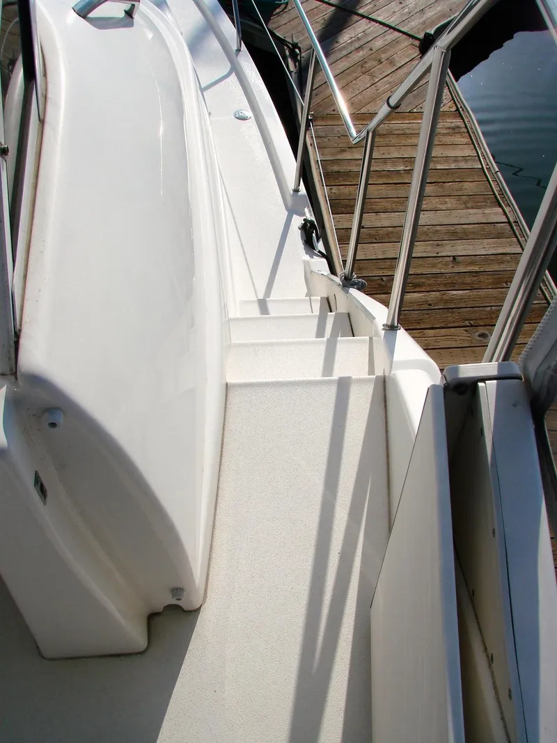 Slide: The Image of 1999 Silverton 351 Sedan boat stairs at dock. - 38