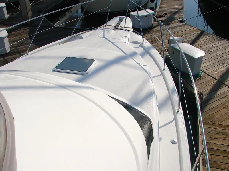 Slide: The Image of 1999 Silverton 351 Sedan docked on a wooden pier. - 39