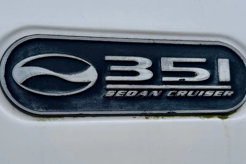 Slide: The Image of 1999 Silverton 351 Sedan Cruiser emblem on white background. - 4