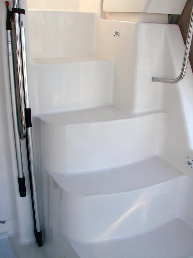 Slide: The Image of White stairs on a 1999 Silverton 351 Sedan boat. - 40