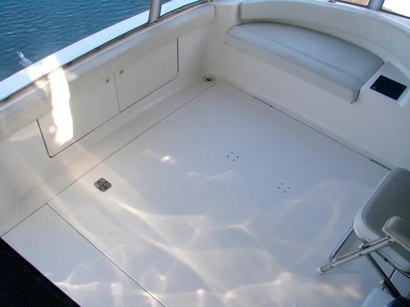 Slide: The Image of Interior of a 1999 Silverton 351 Sedan yacht, white seating and floor. - 41