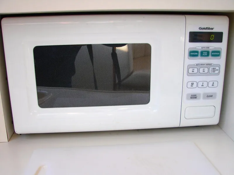 Slide: The Image of White GoldStar microwave in 1999 Silverton 351 Sedan. - 43