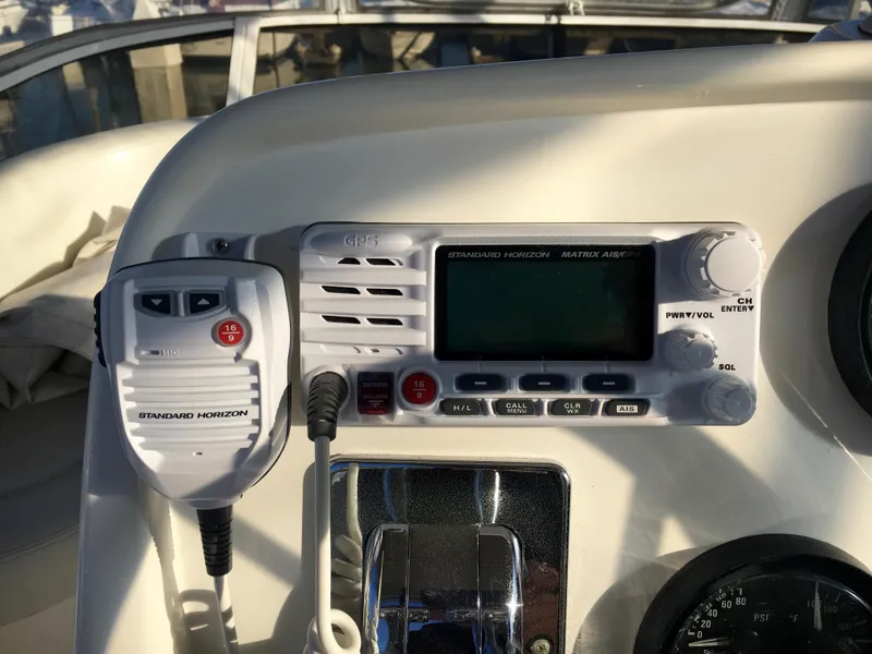 Slide: The Image of 1999 Silverton 351 Sedan boat control panel with radio. - 8