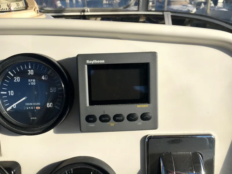 Slide: The Image of Dashboard of a 1999 Silverton 351 Sedan with Raytheon display. - 9