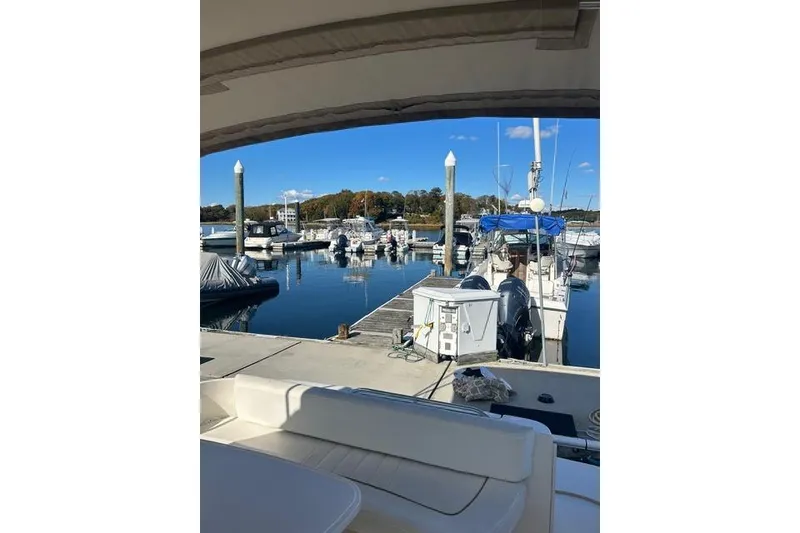 Slide: The Image of Marina view from a 2002 Sea Ray Sundancer 310, showcasing docked boats and clear skies. - 26