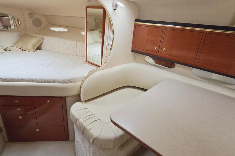 Slide: The Image of Luxurious interior of 2002 Sea Ray Sundancer 310 with cozy bed and elegant wood cabinetry. - 35