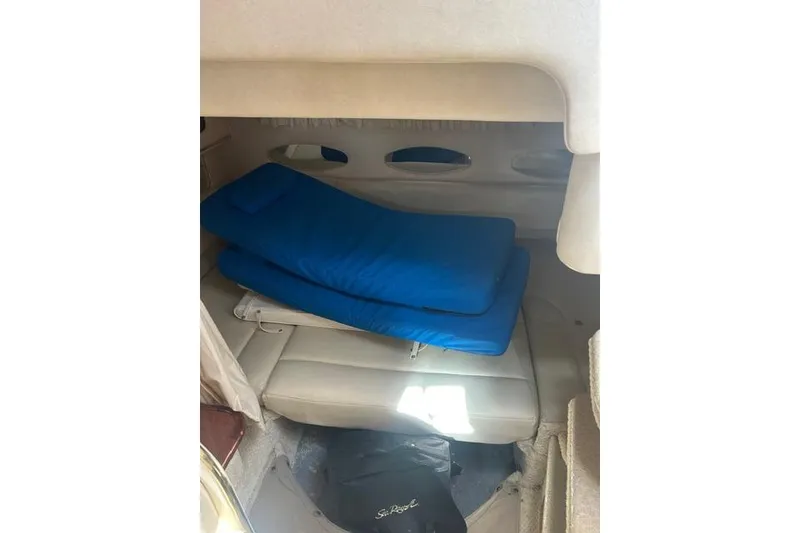 Slide: The Image of Interior cabin of 2002 Sea Ray Sundancer 310 with blue cushions. - 40