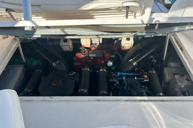 Slide: The Image of Engine compartment of a 2002 Sea Ray Sundancer 310 boat, showcasing mechanical components. - 41