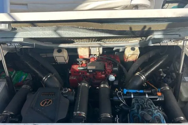 Slide: The Image of Engine compartment of a 2002 Sea Ray Sundancer 310 boat, showcasing mechanical components. - 44
