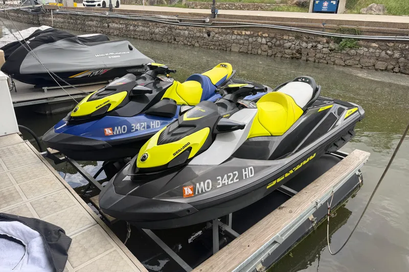 Slide: The Image of 2020 Sea-Doo GTR 230 jet skis docked on a marina platform. - 2
