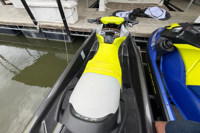 Slide: The Image of 2020 Sea-Doo GTR 230 jet ski docked, featuring a vibrant yellow and gray seat design. - 5