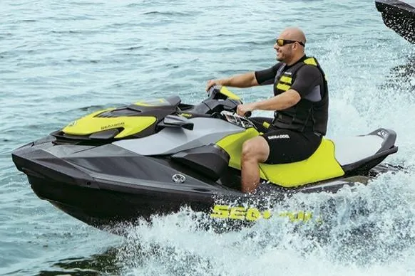 Slide: The Image of Manufacturer Provided Image: Man riding a 2020 Sea-Doo GTR 230 jet ski on the water. - 8