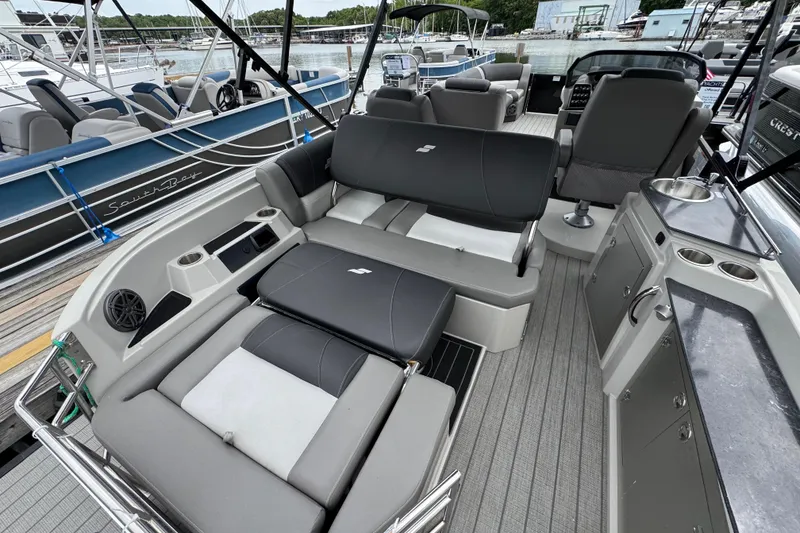 Slide: The Image of 2023 Starcraft MX 25 DL DH boat interior with luxurious seating and modern amenities. - 10