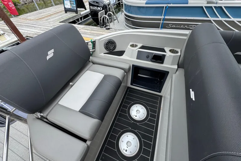 Slide: The Image of 2023 Starcraft MX 25 DL DH boat interior with seating and cup holders. - 14