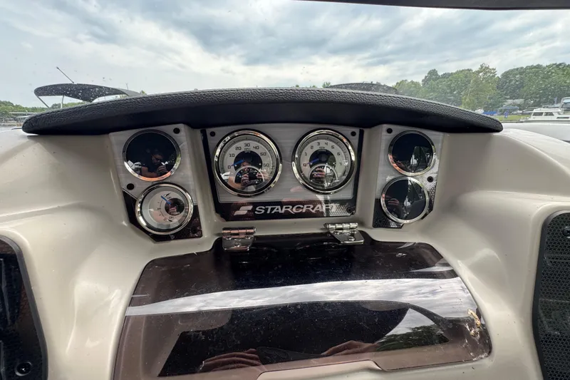 Slide: The Image of Dashboard of 2023 Starcraft MX 25 DL DH boat with gauges and controls. - 21