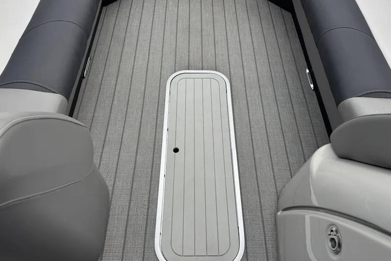 Slide: The Image of 2023 Starcraft MX 25 DL DH boat interior with sleek gray seating and flooring. - 24