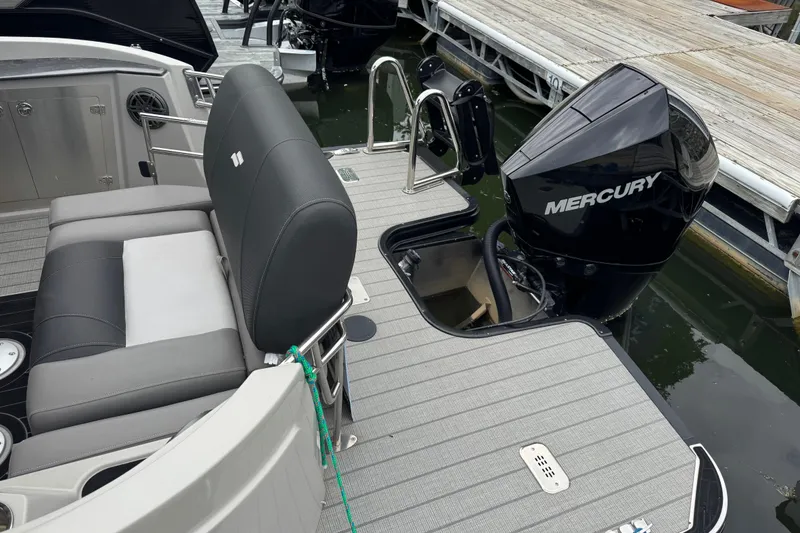 Slide: The Image of 2023 Starcraft MX 25 DL DH boat with Mercury outboard motor at dock. - 3